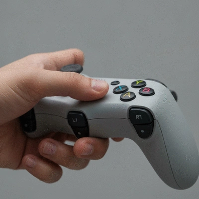 Hand holding a game controller, demonstrating intuitive gameplay